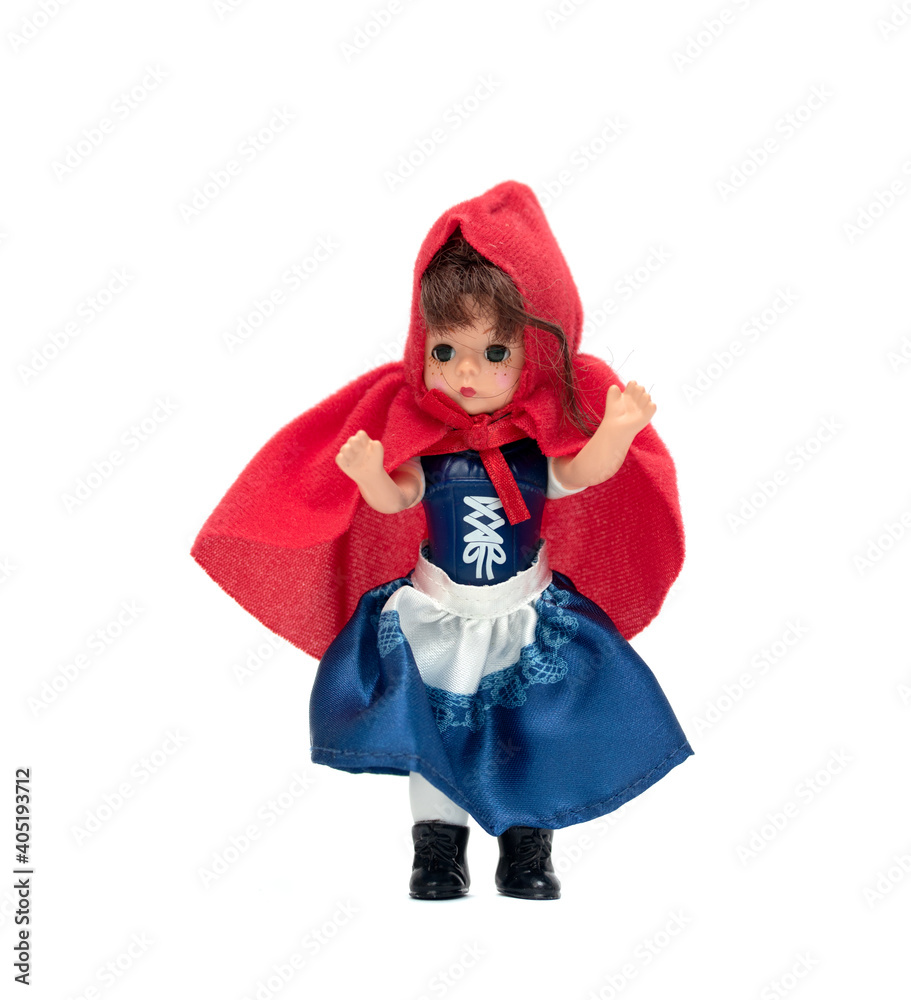 doll girl in a red cap on a white background doll girl in a red cap on a white background