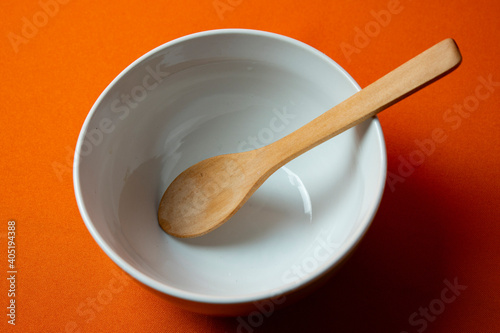 white bowl with orange background