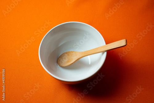 white bowl with orange background