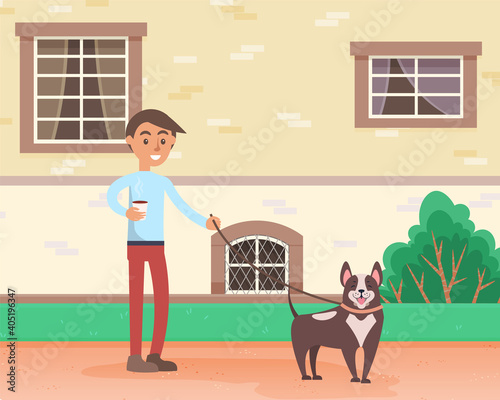 A guy with a dog is walking on the street. A man with a cup of coffee spends time outdoors with his pet. The owner walks with cheerful puppy on a leash in open area against the background of building