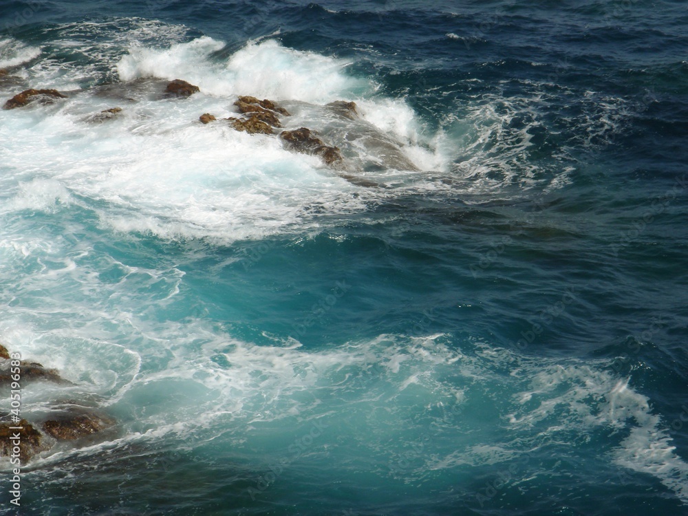 Fototapeta premium Raging waves of the Mediterranean sea beat against the stones.