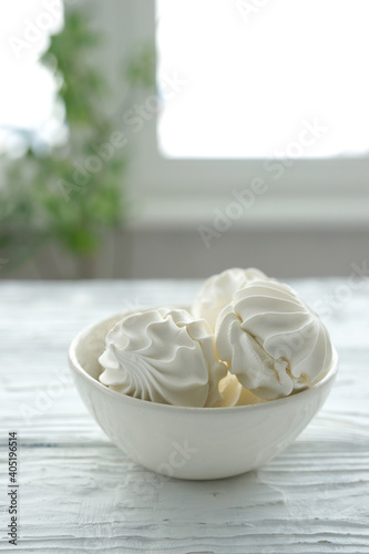 Zephyr in a ceramic bowl on a white wooden background
