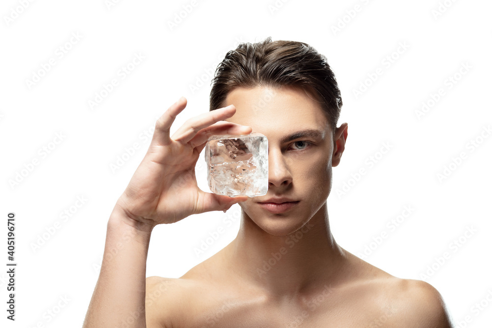Ice cold. Portrait of young man isolated on white studio background. Caucasian attractive male model. Concept of fashion and beauty, self-care, body and skin care. Handsome boy with well-kept skin.