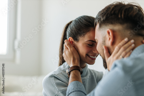 Going for kiss, looking happy, in love.