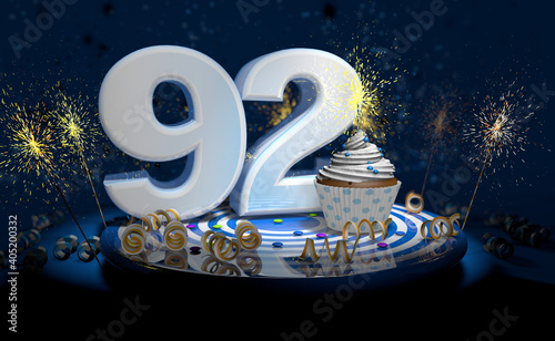 92th birthday or anniversary cupcake with big white number with yellow streamers on blue table with dark background full of sparks. 3d illustration