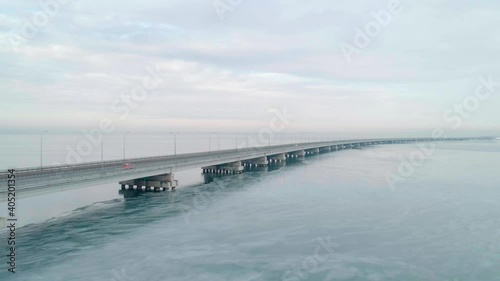 Wallpaper Mural Aerial drone view of low-water bridge across the bay with moving car. Active movement of transport cars vehicles in different directions. Torontodigital.ca