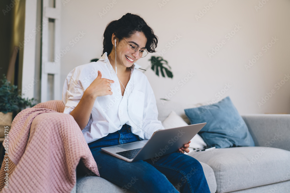 Happy woman having video chat via laptop at home Happy woman having video chat via laptop at home
