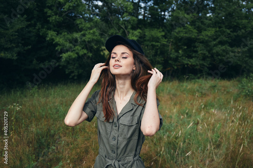 woman in the forest Green jumpsuit closed eyes a delight of nature nature 