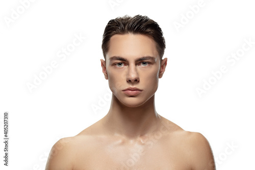 Anger. Portrait of young man isolated on white studio background. Caucasian attractive male model. Concept of fashion and beauty, self-care, body and skin care. Handsome boy with well-kept skin.