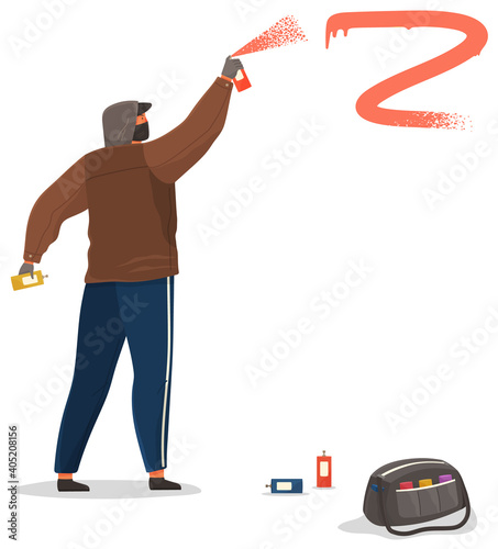 Vandal damaging. Bully in hood and balaclava painting graffiti. Street gangsters and vandalism concept. A man bandit destroy city property. Sprays paint from a balloon, spoils property