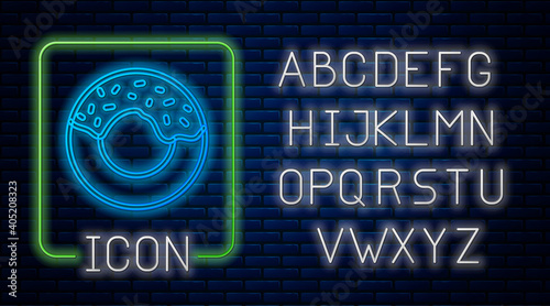 Glowing neon Donut with sweet glaze icon isolated on brick wall background. Neon light alphabet. Vector.
