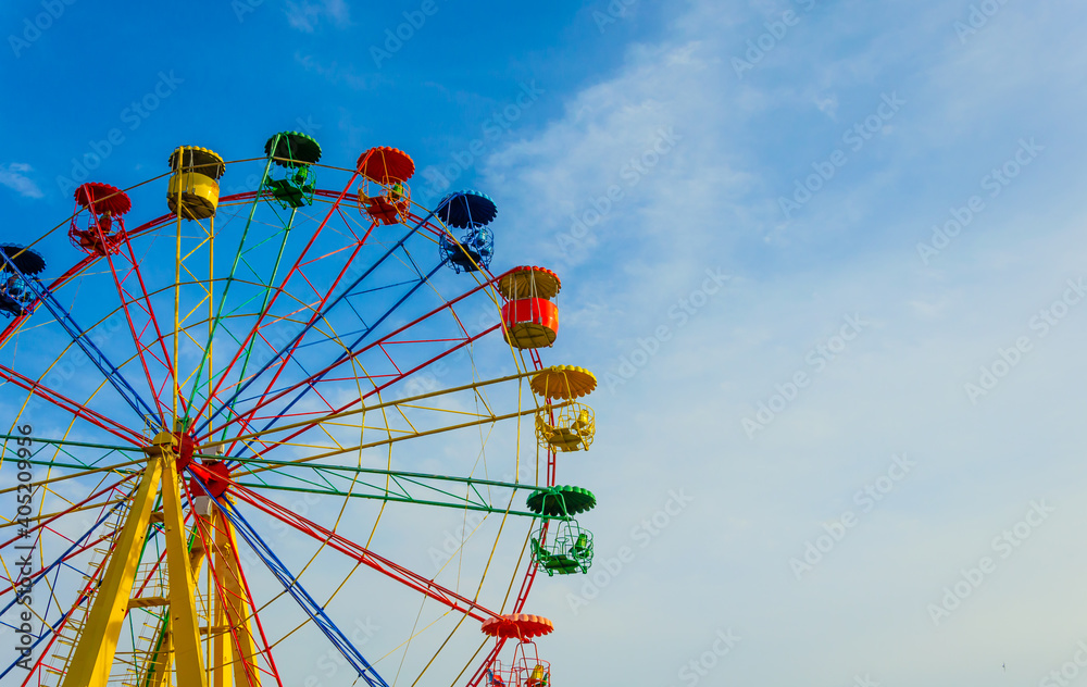 Ferris wheel on a sunny day. Ferris wheel on a sunny day.