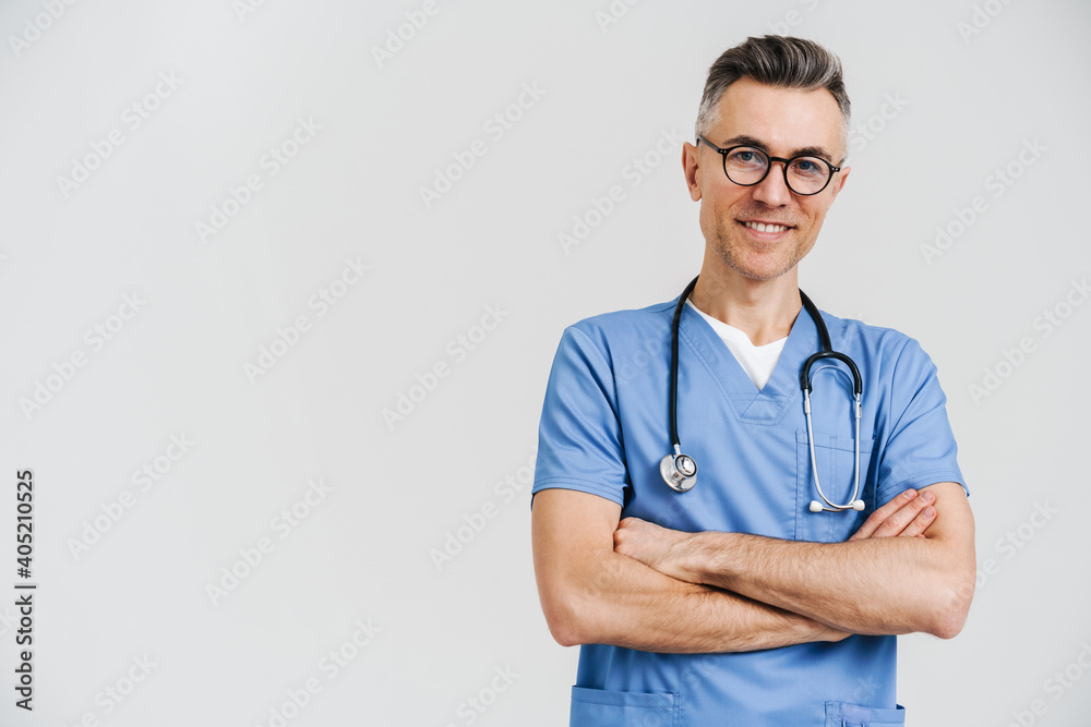 Happy white-haired medical doctor with stethoscope smiling at camera Happy white-haired medical doctor with stethoscope smiling at camera