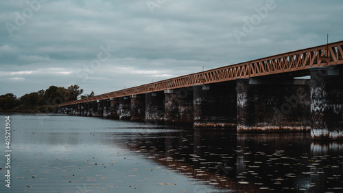 Shot of the Moerputten Bridge over the lake reflecting in the water photo