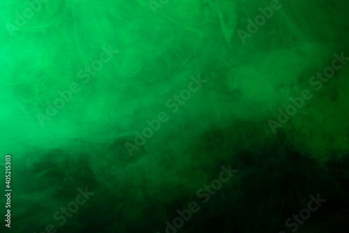 Green smoke on black background