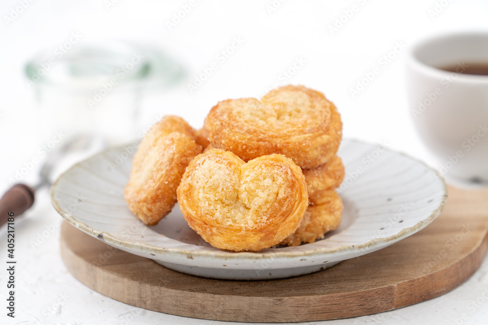 Delicious Palmier butterfly pastry in heart shape for Valentine's day dessert. Delicious Palmier butterfly pastry in heart shape for Valentine's day dessert.