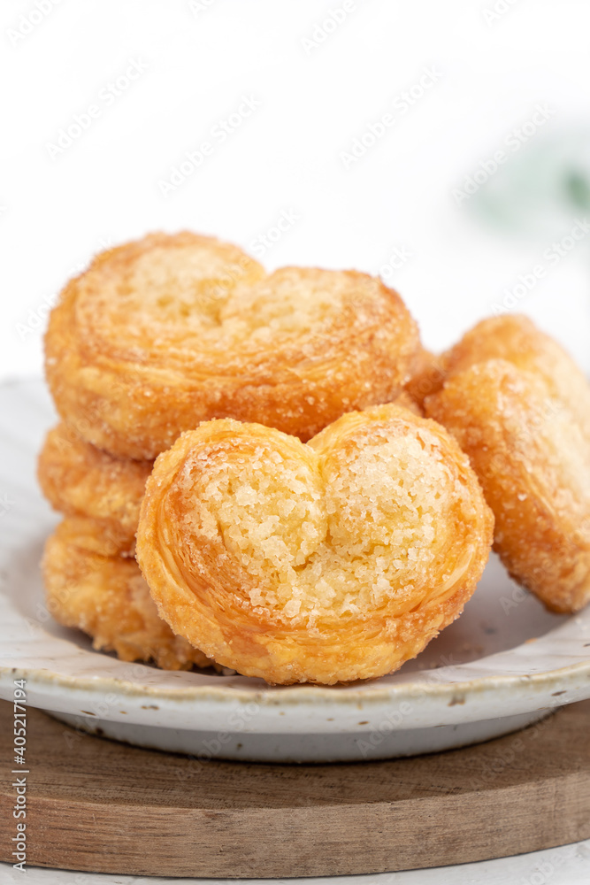 Delicious Palmier butterfly pastry in heart shape for Valentine's day dessert. Delicious Palmier butterfly pastry in heart shape for Valentine's day dessert.