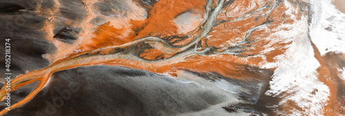 Aerial view of river delta colored by runoff, near Hvammur, Iceland photo