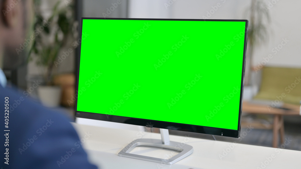 Businessman Working on Desktop with Green Chroma Key Screen Businessman Working on Desktop with Green Chroma Key Screen