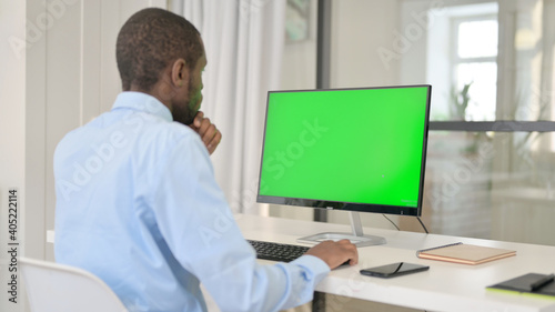 Businessman Celebrating While Using Desktop with Green Chroma Key Screen