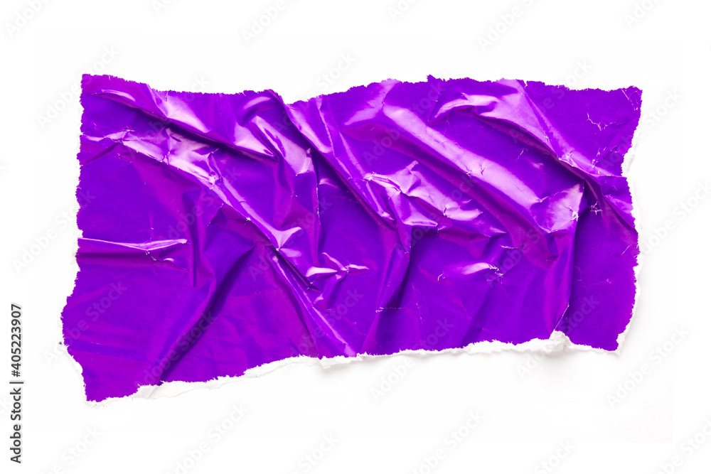 Torn and crumpled piece of purple glossy magazine paper isolated on white background. Copy space for text.