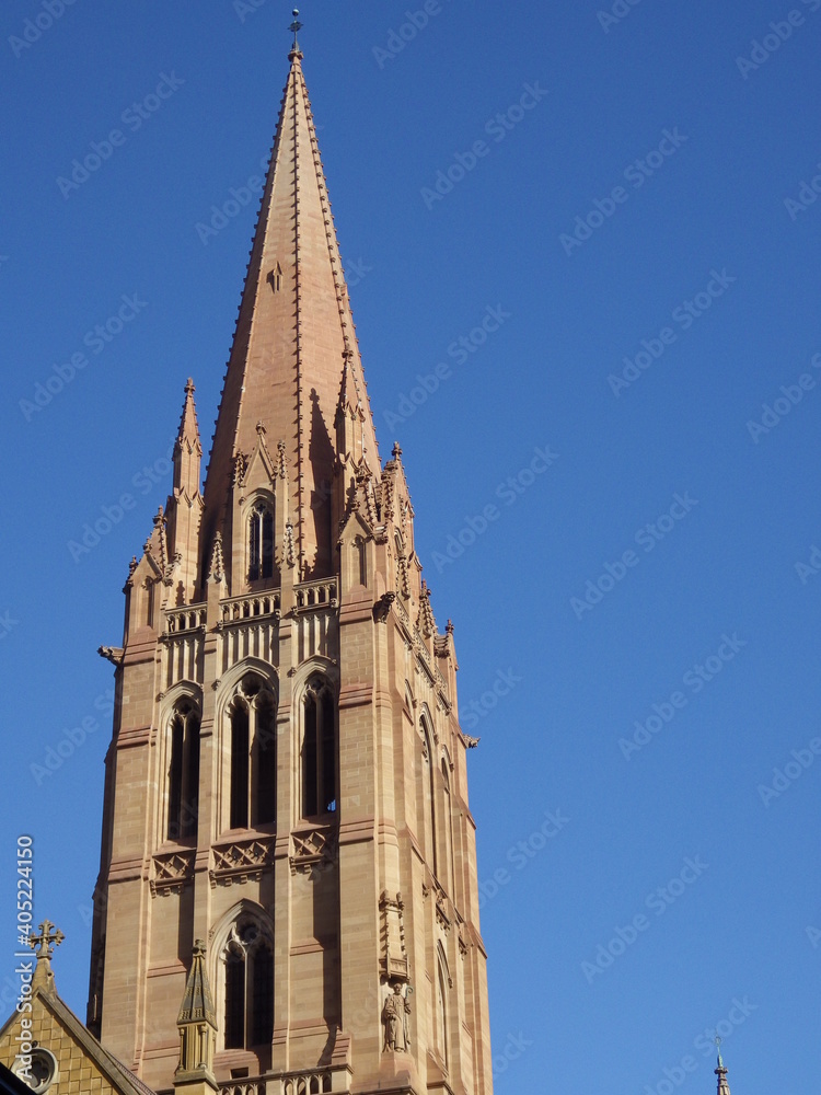 Tower  of  St Pual s cathedral at Melbourne Australia with blue sky. Gothic architecture church