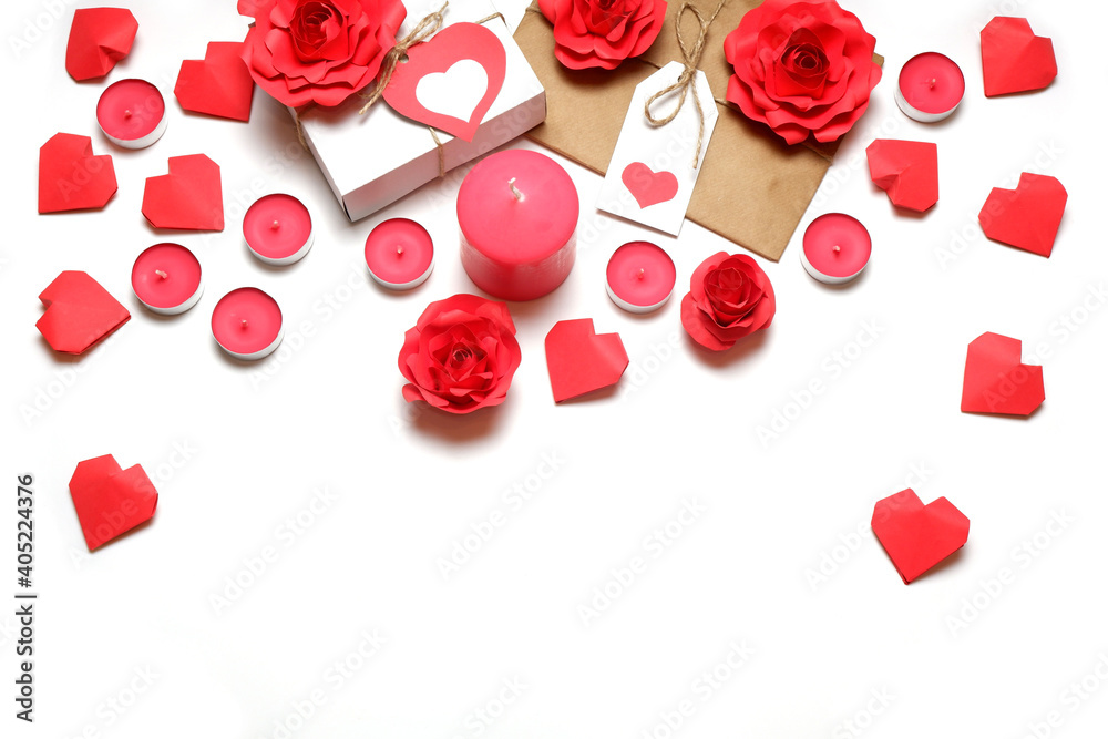 Several pink wax candles, gifts, 3D handmade red paper roses and hearts on white background. Love, Valentine's, mother's, women's day, relations, romantic, wedding concept