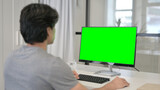 Businessman Using Desktop with Green Chroma Key Screen 