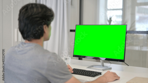 Businessman Using Desktop with Green Chroma Key Screen  © stockbakers