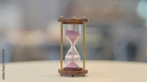 Fotografi Close Up of Hourglass on Table