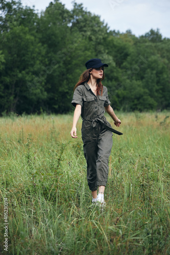 Woman in the meadow Green suit black cap fresh air freedom  © SHOTPRIME STUDIO
