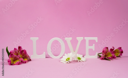 St.Valentine's card. Purple alstroemerias with the word love © Elena