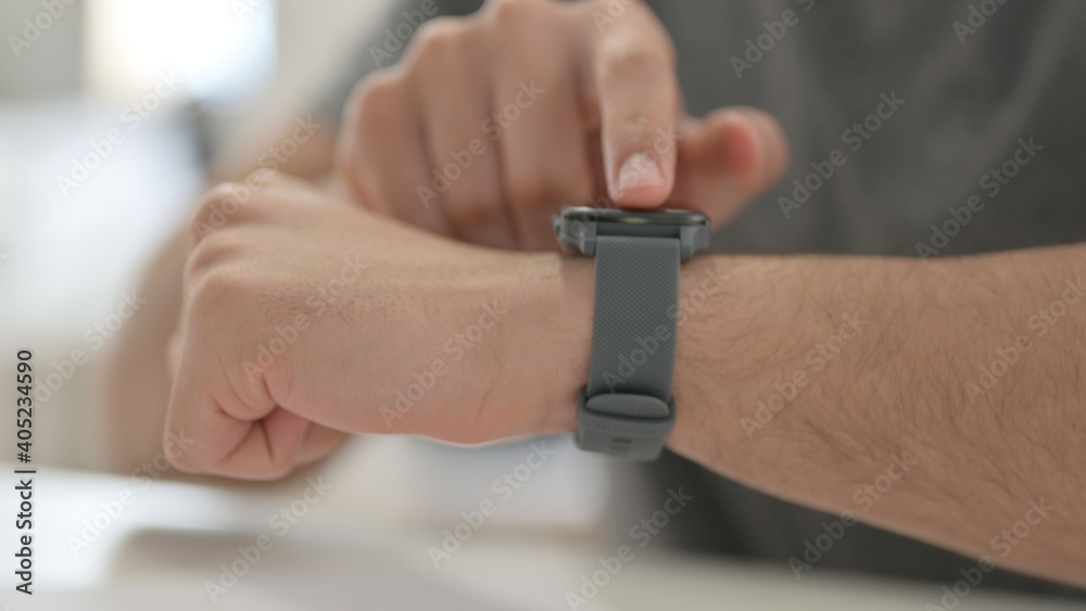 Hands of Young Man Using Smartwatch, Close Up
