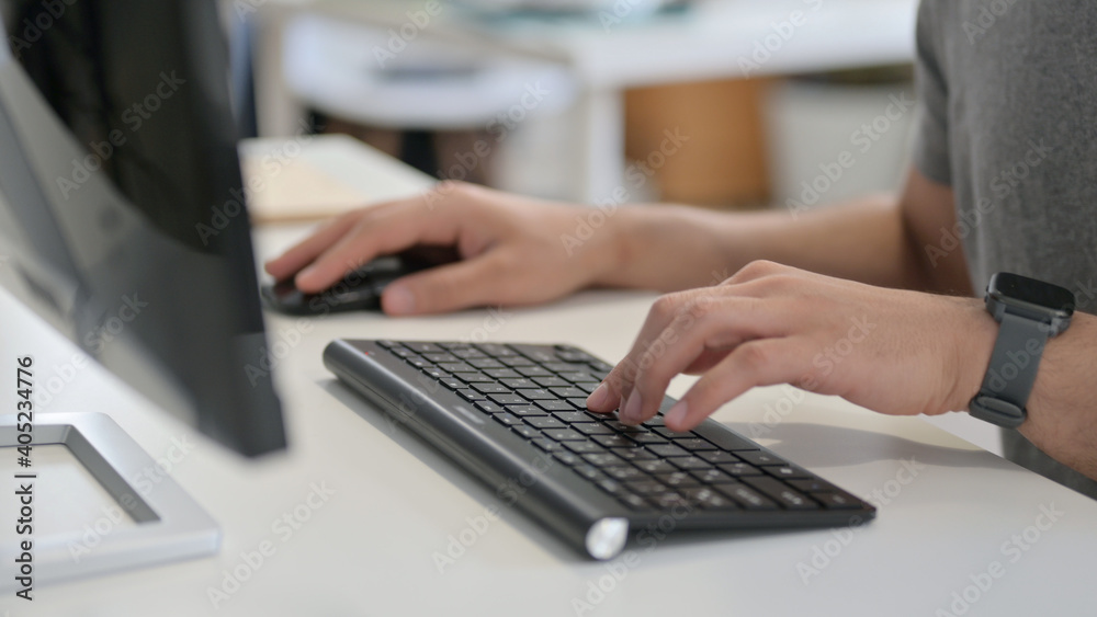 Hands of Young Man Using Mouse and Keyboard, Close Up Hands of Young Man Using Mouse and Keyboard, Close Up