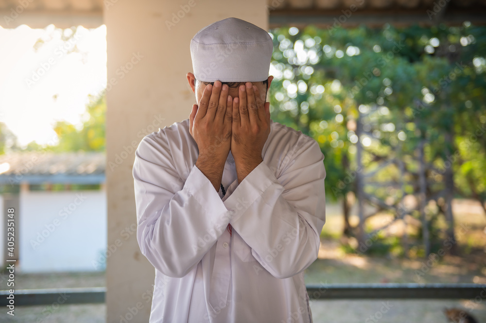 Asian islam man prayer,Young Muslim praying,Ramadan festival concept Asian islam man prayer,Young Muslim praying,Ramadan festival concept