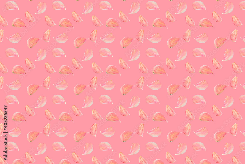 Seamless food pattern. Pink colour garlic cloves on colourful background. From above