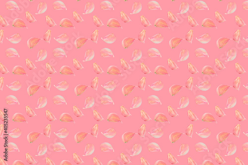 Seamless food pattern. Pink colour garlic cloves on colourful background. From above