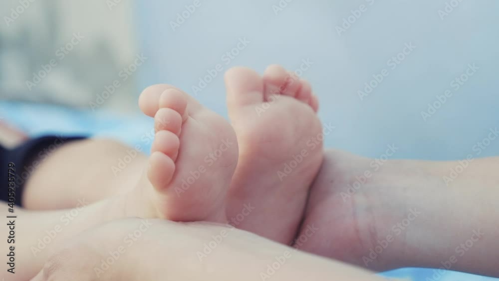 legs feet baby face model a portrait. concept love kid dream happy family massage care. close up legs feet little boy baby. mom holds baby in her arms dream legs feet baby face model a portrait. concept love kid dream happy family massage care. close up legs feet little boy baby. mom holds baby in her arms dream