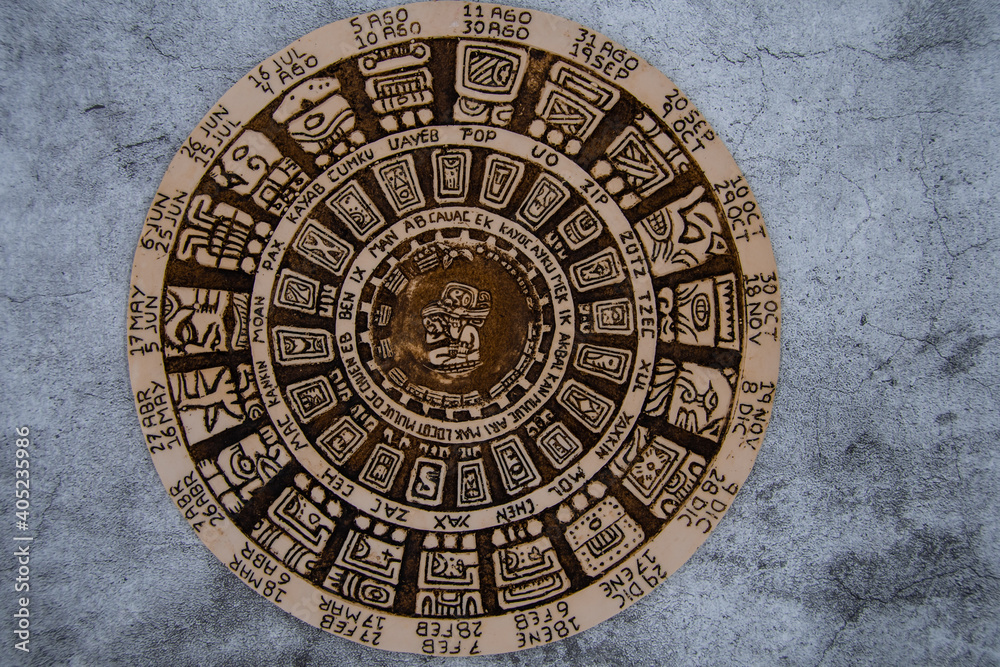 A Mayan calendar on a concrete surface
