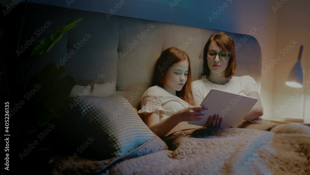 Mother and Daughter Watch Funny Movie on Tablet