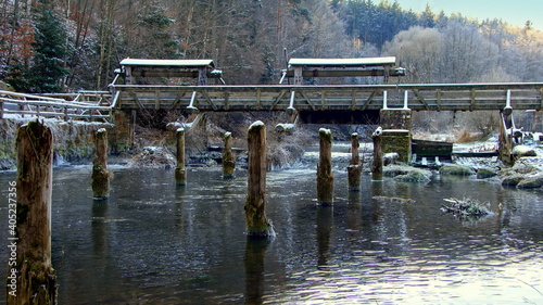 historisches Stauwehr für Flößer im Schwarzwald an der Nagold bei Altensteig im Winter photo