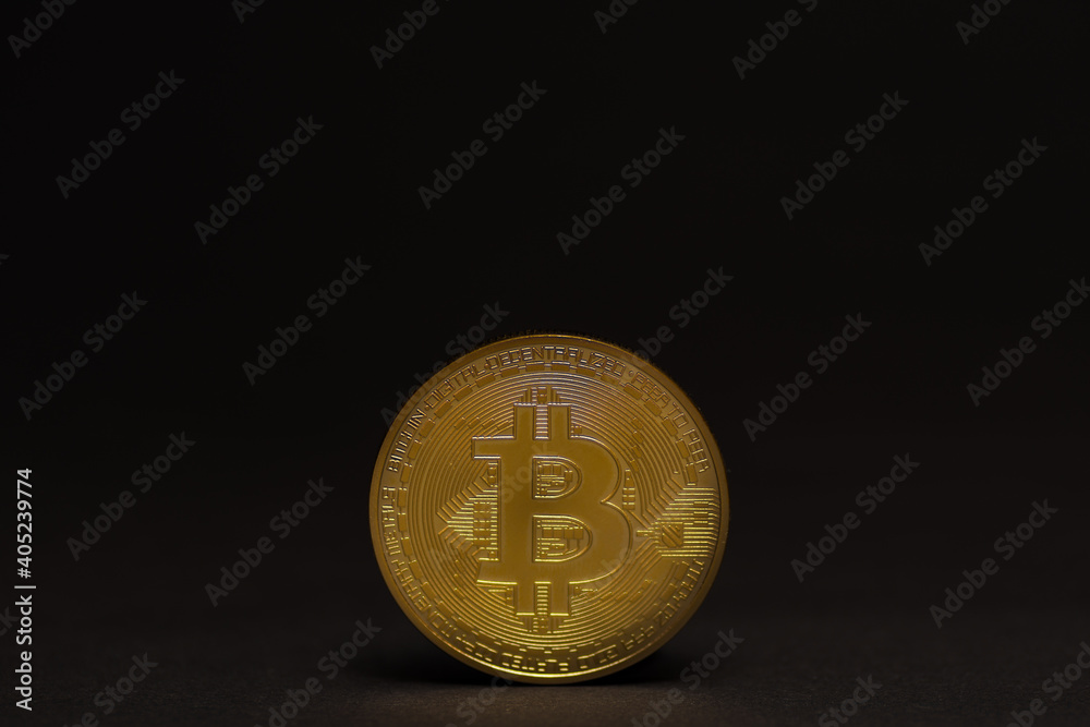 single golden shiny valuable bitcoin standing on a black background middle bottom single golden shiny valuable bitcoin standing on a black background middle bottom