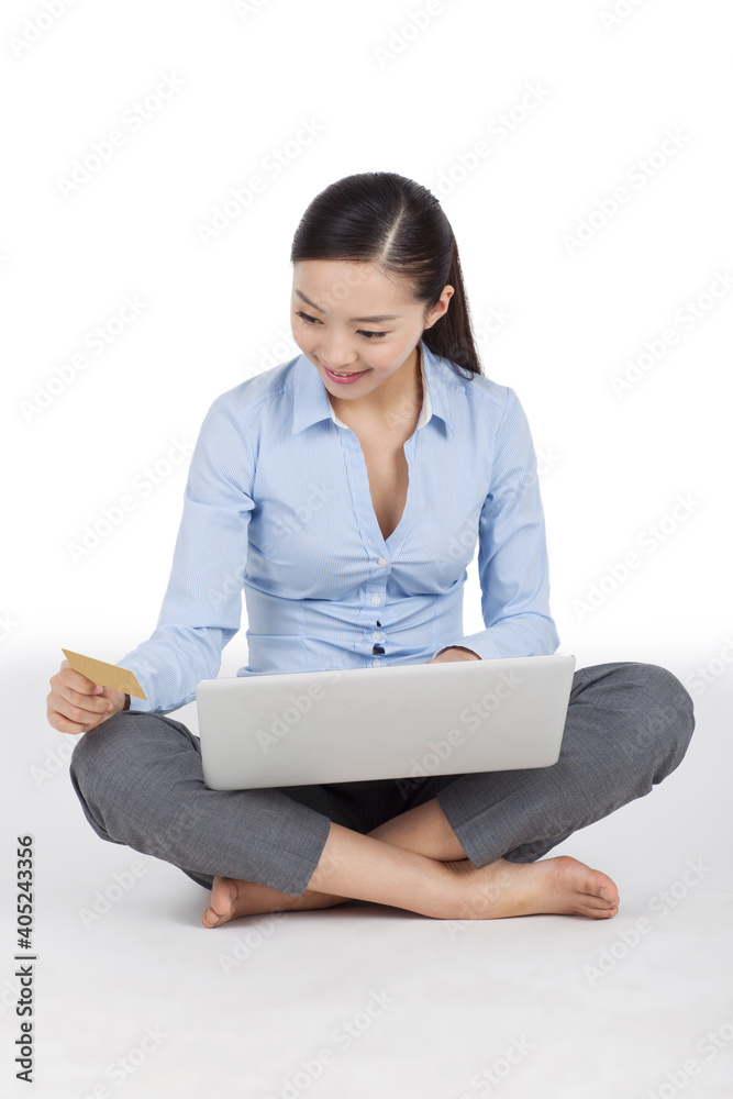 Business woman holding up blank business card Business woman holding up blank business card
