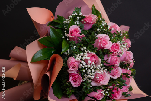 Fototapeta Naklejka Na Ścianę i Meble -  Bridal bouquet with pink roses and small white flowers