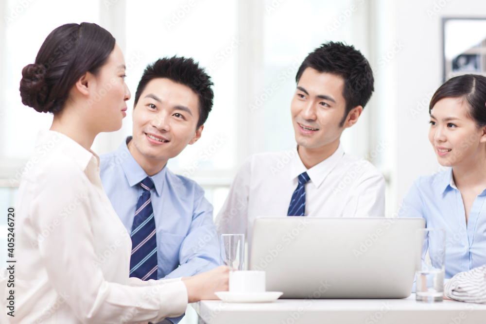 Group of business people discussing in office Group of business people discussing in office
