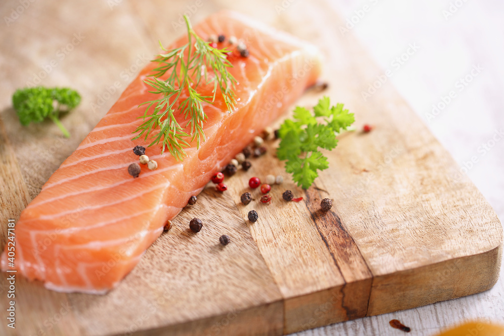 salmon steak on wooden background