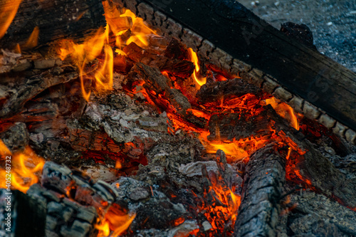 Burning coals at night, rotting coal, barbecue season. Close-up.