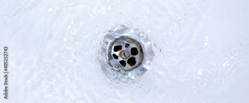 water draining from sink, pouring liquid in the hole