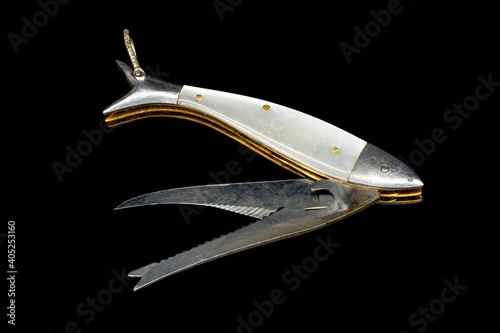 Old fishing knife with two blades on black background
