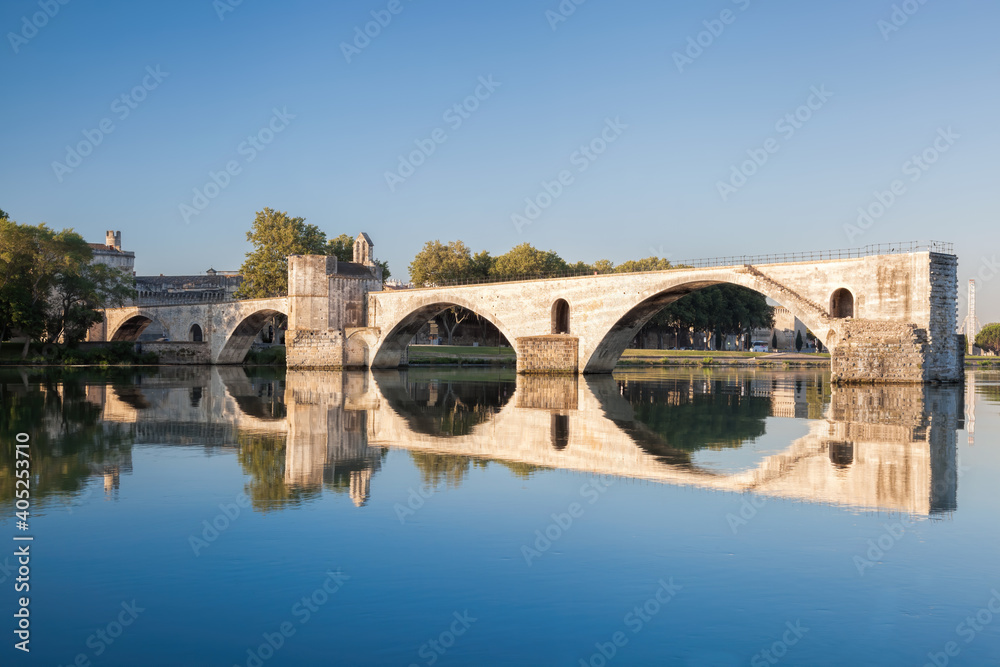 Avignon, famous bridge with Rhone river against blue sky in Provence, France